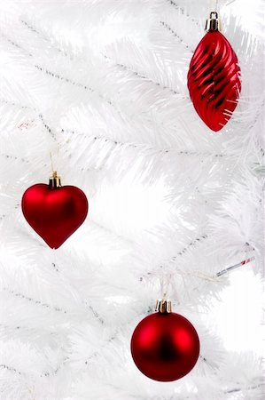 round ornament hanging of a tree - Christmas ornaments hanging from a white tree Stock Photo - Budget Royalty-Free & Subscription, Code: 400-04935170