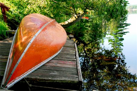 red canoe on lake - Canoe on wooden dock on a lake Stock Photo - Budget Royalty-Free & Subscription, Code: 400-04935208