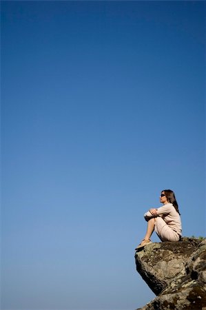 A young woman sitting on a rocky outcrop in the Caldera de Los Marteles in Gran Canaria Stock Photo - Budget Royalty-Free & Subscription, Code: 400-04935468
