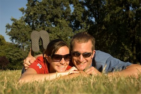 Happy couple relaxing in the park in summer Stock Photo - Budget Royalty-Free & Subscription, Code: 400-04935478