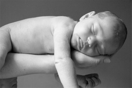 Close up of newborn baby sleeping in mothers' hand Stock Photo - Budget Royalty-Free & Subscription, Code: 400-04936575