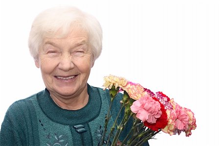 spirited - Smiling old woman with bunch of flowers, isolated on white background Foto de stock - Super Valor sin royalties y Suscripción, Código: 400-04937011