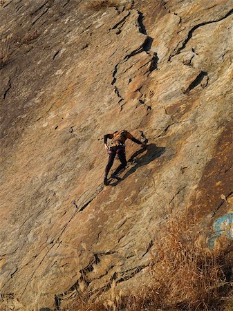 simsearch:400-04041278,k - climber on the orange rock Photographie de stock - Aubaine LD & Abonnement, Code: 400-04937029