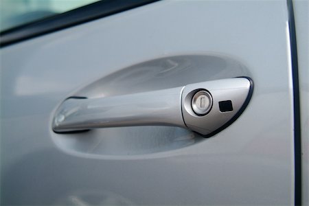fotofritz (artist) - a silver-colored door pull from a car Foto de stock - Super Valor sin royalties y Suscripción, Código: 400-04937490