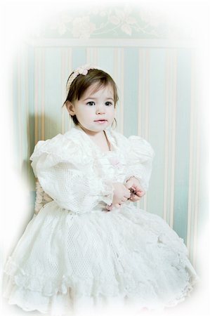 Victorian style portrait of cute little girl dressed in the formal wear. Copy space in the top right corner Stock Photo - Budget Royalty-Free & Subscription, Code: 400-04937532