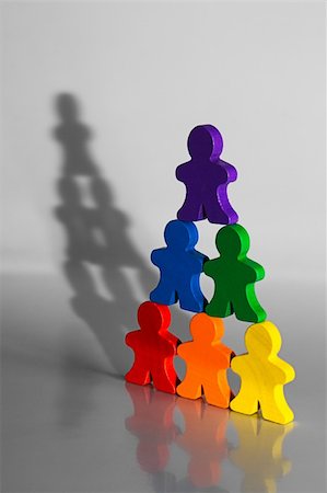 segregation - Colorful wooden people used to illustrate business concepts. Teamwork and Diversity. Stock Photo - Budget Royalty-Free & Subscription, Code: 400-04937630
