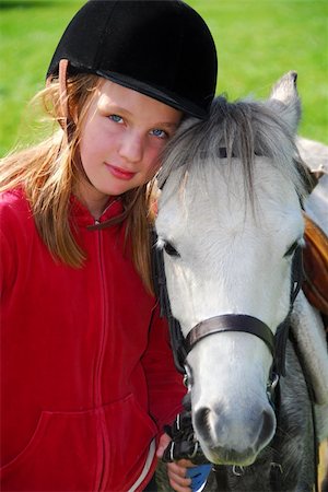 simsearch:400-07168060,k - Portrait of a young girl with a white pony Stock Photo - Budget Royalty-Free & Subscription, Code: 400-04937644