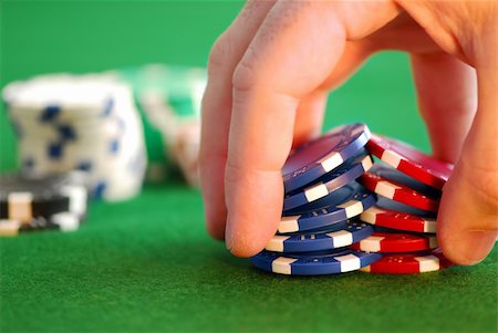 playing cards shuffle - Close up on man's hand doing a pocker chip trick "shuffle" Stock Photo - Budget Royalty-Free & Subscription, Code: 400-04937641