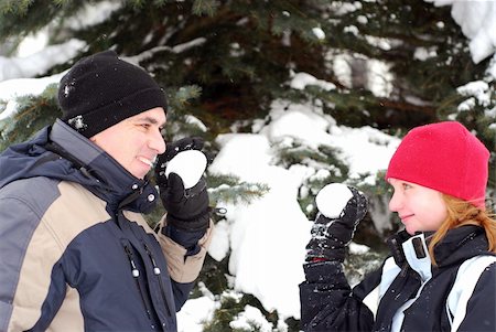 snowball fight child - Father and child holding snowballs in winter park Stock Photo - Budget Royalty-Free & Subscription, Code: 400-04937673