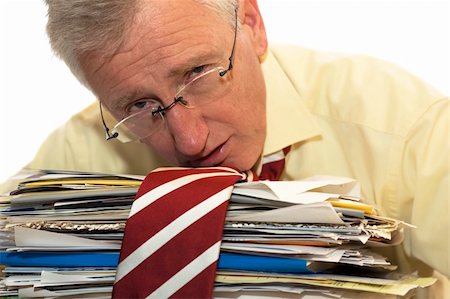 simsearch:640-03264416,k - An exhausted businessman has had too much of his paperwork. Photographie de stock - Aubaine LD & Abonnement, Code: 400-04937782