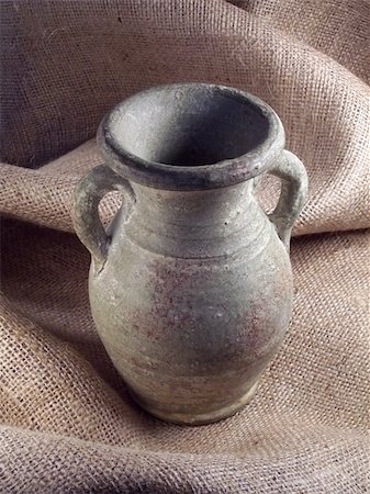 Clay vase on burlap. Stock Photo - Budget Royalty-Free & Subscription, Code: 400-04937920