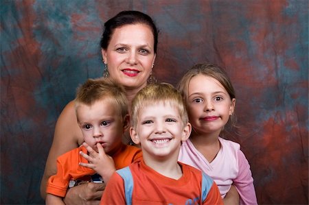 simsearch:400-08955829,k - proud grandmother of three, surrounded by the grandchildren Stock Photo - Budget Royalty-Free & Subscription, Code: 400-04937934