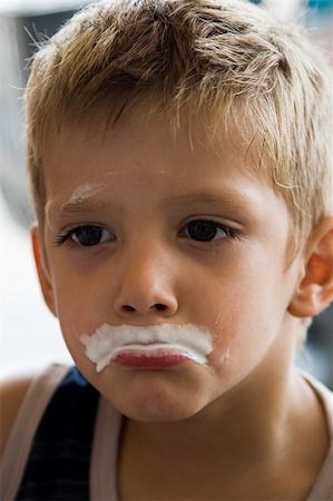 photos of boys lips - Dirty child, mouth full with ice cream, Stock Photo - Budget Royalty-Free & Subscription, Code: 400-04937936