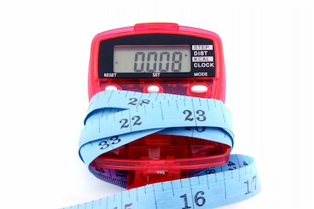 pedometer - Close up of a Pedometer and tape measure - isolated on a white background Stock Photo - Budget Royalty-Free & Subscription, Code: 400-04937954