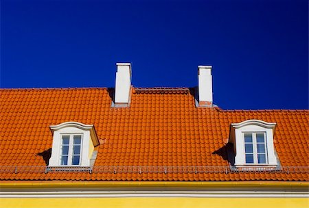 simsearch:400-04419242,k - Orange roof with two windows and chimneys against blue sky Stock Photo - Budget Royalty-Free & Subscription, Code: 400-04938027