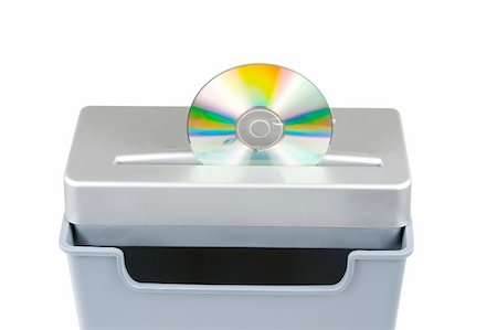 recycle bins for the home - shredding cd media isolated on a white background Stock Photo - Budget Royalty-Free & Subscription, Code: 400-04938260