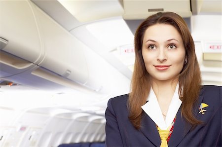 simsearch:400-04429524,k - air hostess (stewardess) in the empty airliner cabin Stock Photo - Budget Royalty-Free & Subscription, Code: 400-04938520