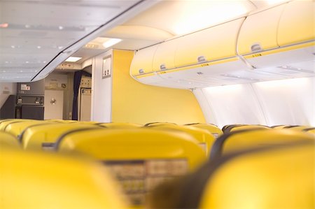 simsearch:625-00805855,k - inside a airplane cabine with yellow seats Stock Photo - Budget Royalty-Free & Subscription, Code: 400-04938657