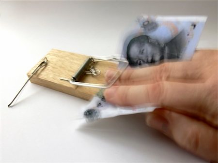 and snatching Chinese banknotes from mousetrap; motion blur on hand; trap has snapped down on fingers; extensive, exciting motion blur! Stock Photo - Budget Royalty-Free & Subscription, Code: 400-04938796