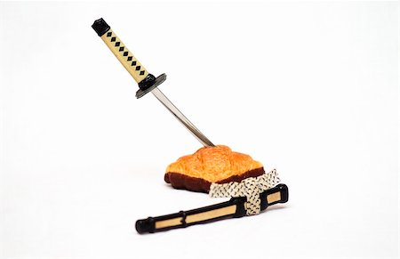 sushi dessert - katana cutting a croisant isolated on white background Foto de stock - Super Valor sin royalties y Suscripción, Código: 400-04938935