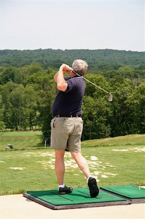 simsearch:400-05038623,k - Golfer at Driving Range Stock Photo - Budget Royalty-Free & Subscription, Code: 400-04939139