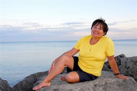 senior woman exercising by ocean - Mature woman relaxing on a shore Stock Photo - Budget Royalty-Free & Subscription, Code: 400-04939176