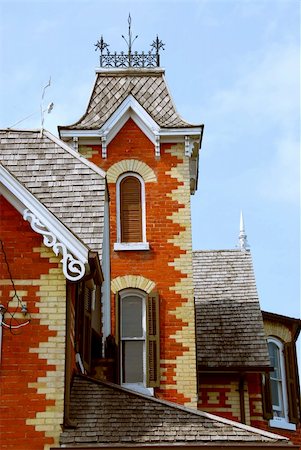 Fragment of a beautiful red brick victorian house Stock Photo - Budget Royalty-Free & Subscription, Code: 400-04939200