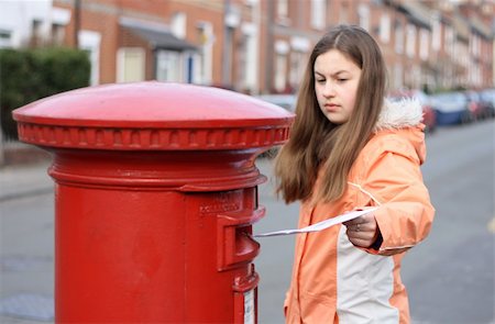 england post box - girl posting letter to red british postbox on street Stock Photo - Budget Royalty-Free & Subscription, Code: 400-04939328