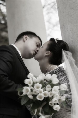 diadème - Beautiful the bride and the groom kiss at columns Stock Photo - Budget Royalty-Free & Subscription, Code: 400-04939662