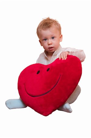 Cute little boy holds big red velvet heart with big smile on it. Isolated on white background Stock Photo - Budget Royalty-Free & Subscription, Code: 400-04939855