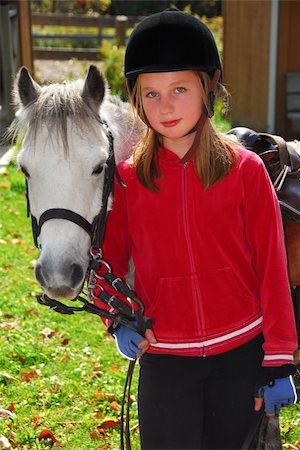 Portrait of a young girl with a white pony Foto de stock - Super Valor sin royalties y Suscripción, Código: 400-04939932