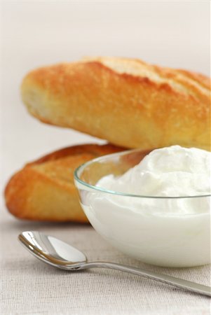Fresh yogurt served in a clear glass bowl and bread Stock Photo - Budget Royalty-Free & Subscription, Code: 400-04939968