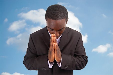 This is an image of a business man bowing his head, as a sign of respect or in a gesture of praying. This can also represent "Prayer", "Answer", "Appreciation" etc... Fotografie stock - Microstock e Abbonamento, Codice: 400-04931863