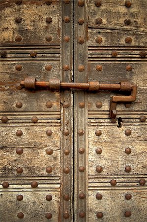 studded door - Medieval door bolt locked door Stock Photo - Budget Royalty-Free & Subscription, Code: 400-04932214