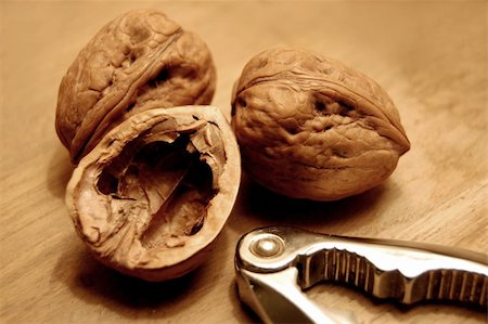 simsearch:400-04415203,k - Three walnuts and nutcrackers macro shot. Fotografie stock - Microstock e Abbonamento, Codice: 400-04932216