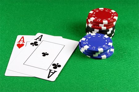 Playing cards showing a pair of aces with poker chips next to them Stock Photo - Budget Royalty-Free & Subscription, Code: 400-04932613