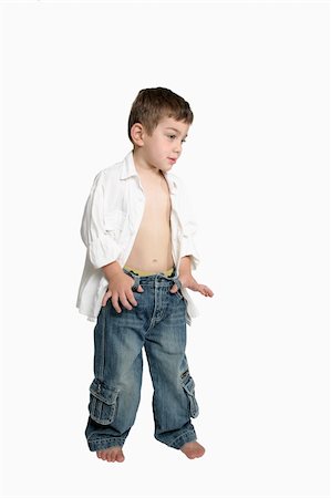 Child with attitude, standing with thumbs hooked in beltloops - white background Stock Photo - Budget Royalty-Free & Subscription, Code: 400-04933028
