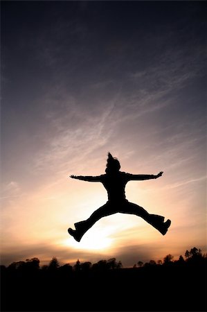 Jump for Joy - Silhouette Stock Photo - Budget Royalty-Free & Subscription, Code: 400-04933192