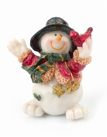 simsearch:400-05681859,k - miniature Snowman statues in different poses against white background with clipping paths Stock Photo - Budget Royalty-Free & Subscription, Code: 400-04933396