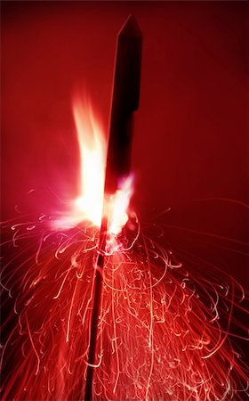 rocket flames - Close up shot of a firework, motion blur Photographie de stock - Aubaine LD & Abonnement, Code: 400-04933496