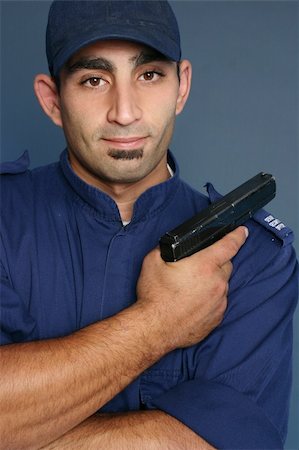 race pistol - Security officer wearing a blue uniform. Stock Photo - Budget Royalty-Free & Subscription, Code: 400-04933849