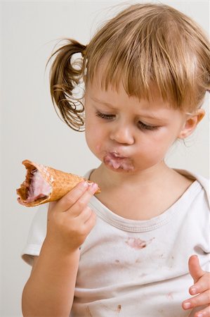 young girl eating tasty ice cream Stock Photo - Budget Royalty-Free & Subscription, Code: 400-04944586