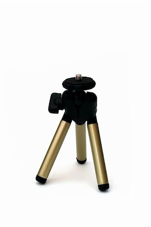 projector light in a movie theatre - A Camera Tripod isolated against a white background Photographie de stock - Aubaine LD & Abonnement, Code: 400-04944912