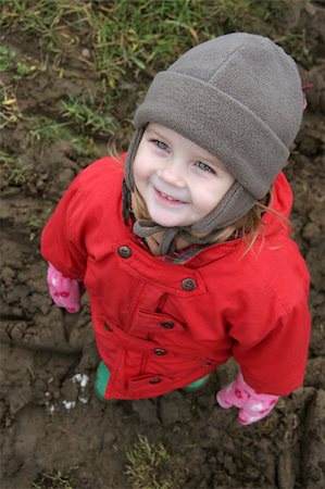 child in red looking upward Stock Photo - Budget Royalty-Free & Subscription, Code: 400-04944927