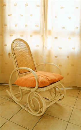 Antique wooden rocking chair near the window illuminated by the spring sun Stock Photo - Budget Royalty-Free & Subscription, Code: 400-04945048