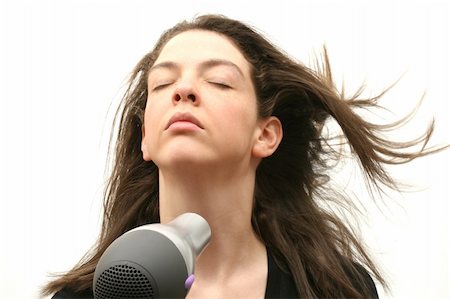 simsearch:400-04204790,k - Girl with hairdryer. Isolated over white Photographie de stock - Aubaine LD & Abonnement, Code: 400-04945105