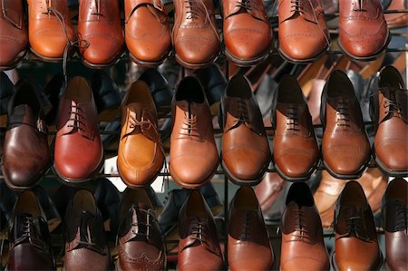 Lines of brown leather shoes for men on a stand. Stock Photo - Budget Royalty-Free & Subscription, Code: 400-04945149