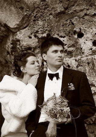 simsearch:400-04440941,k - Recently married pair on a background of a stone. b/w+sepia Fotografie stock - Microstock e Abbonamento, Codice: 400-04945848