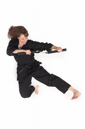 woman doing karate over white background Photographie de stock - Aubaine LD & Abonnement, Code: 400-04946068