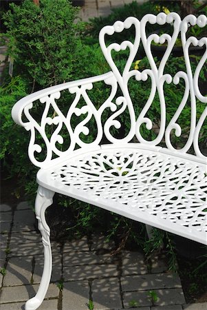 simsearch:400-06178466,k - White wrought iron bench in a garden Stock Photo - Budget Royalty-Free & Subscription, Code: 400-04946163